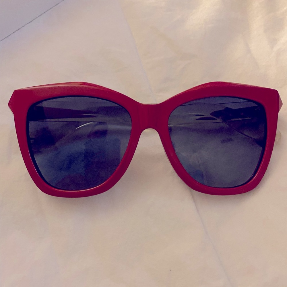 Sunglasses by Givenchy, worn only 1 time. Red w/ clear sides